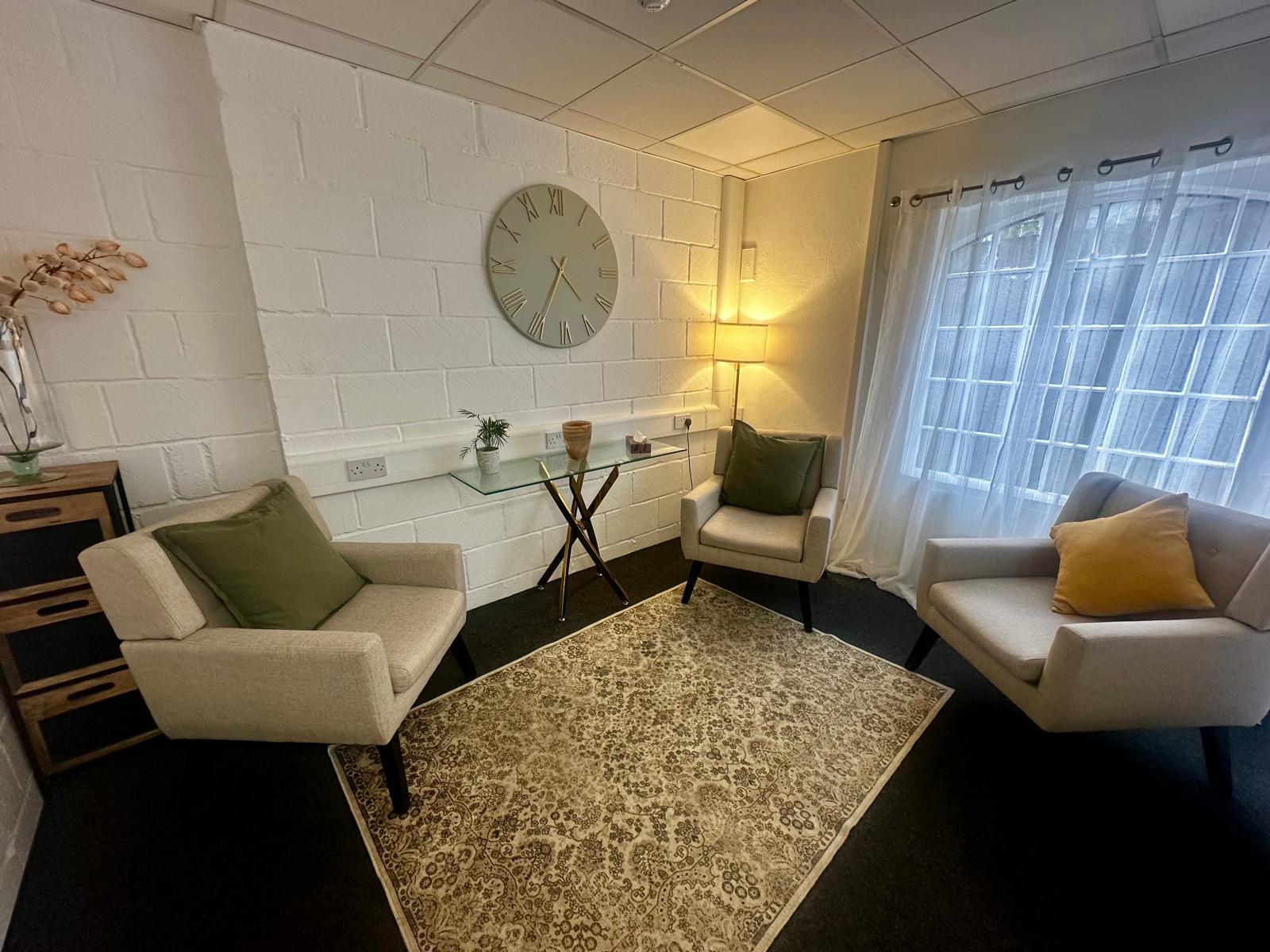 Interior of the therapy room — armchairs, soft lighting and a calm, welcoming space